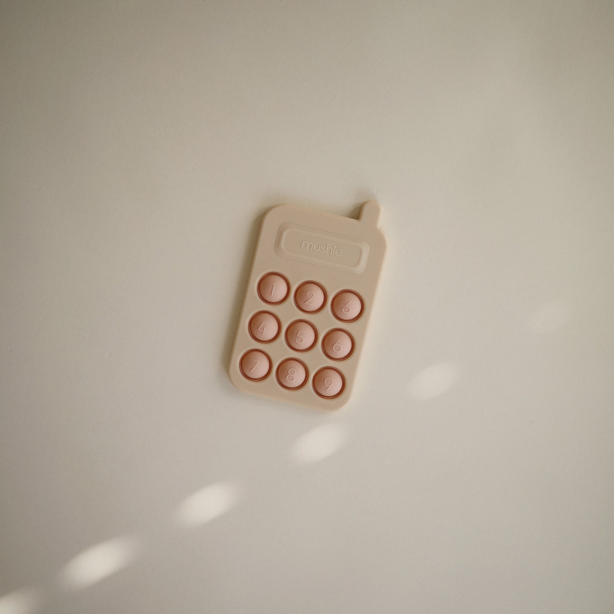 Mushie - Phone Press Toy (Blush)