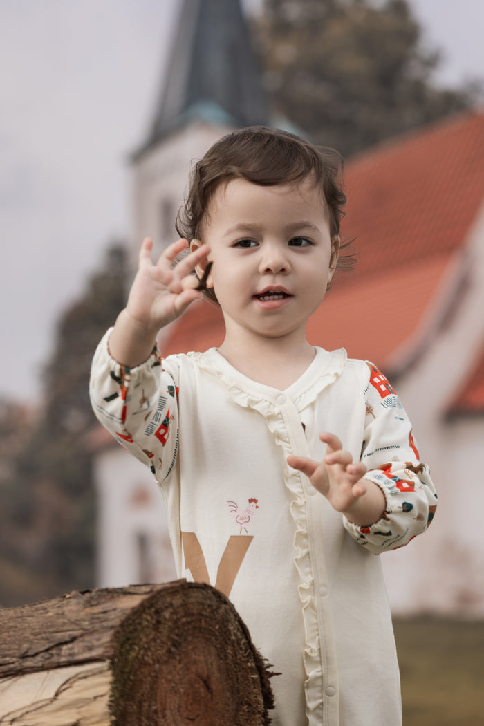 Vauva FW23 - Baby Girl Nordic Style Print Cotton Long Sleeve Romper (White) model front