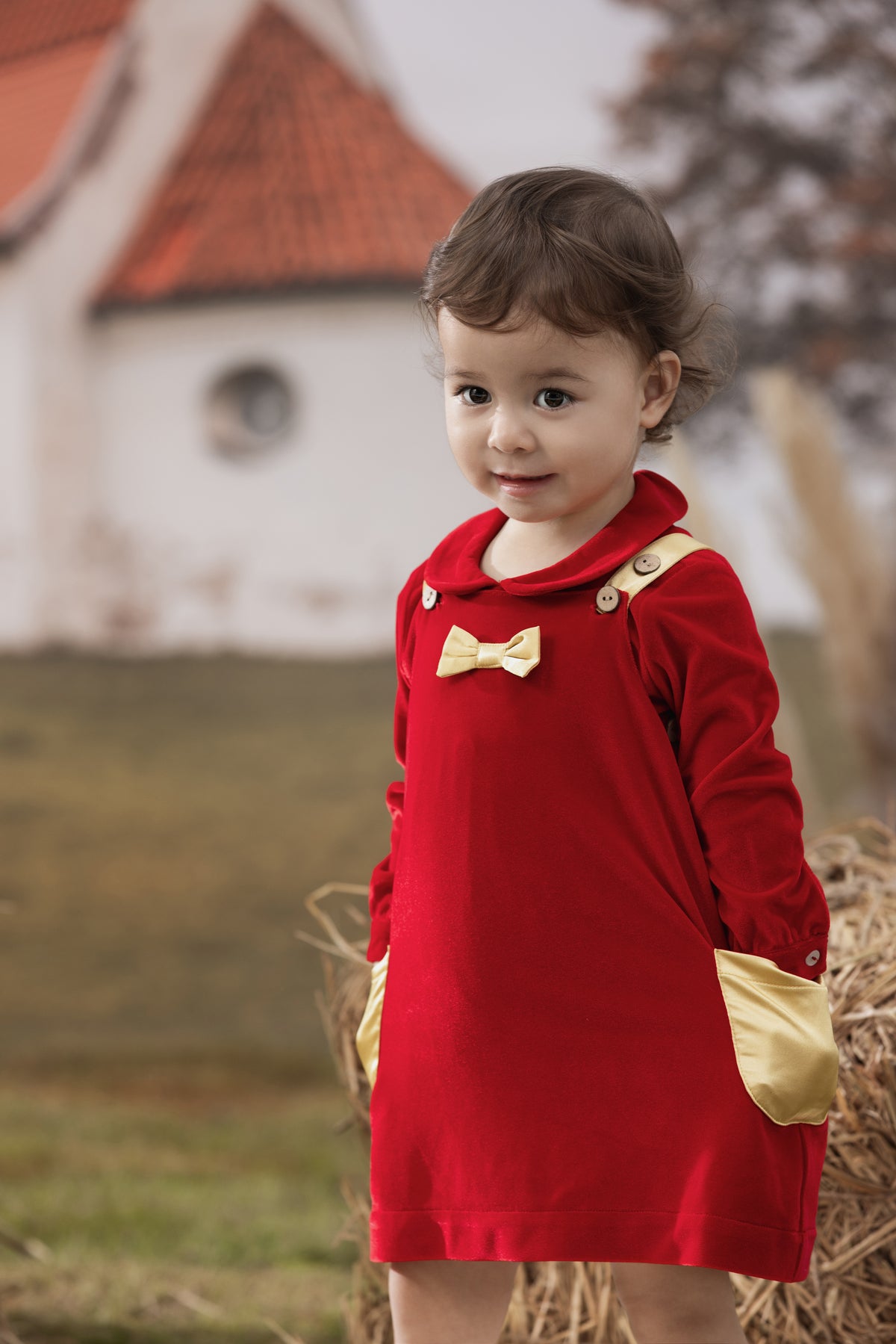 Vauva FW23 - Baby Girls Red Corduroy Dress model front