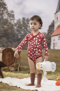 Vauva x Moomin FW23 - Baby Girls Moomin All Over Print Cotton Long Sleeve Bodysuit (Red) model front