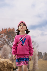 Vauva FW23 - Girls Pink Printed Sweater Skirt model front