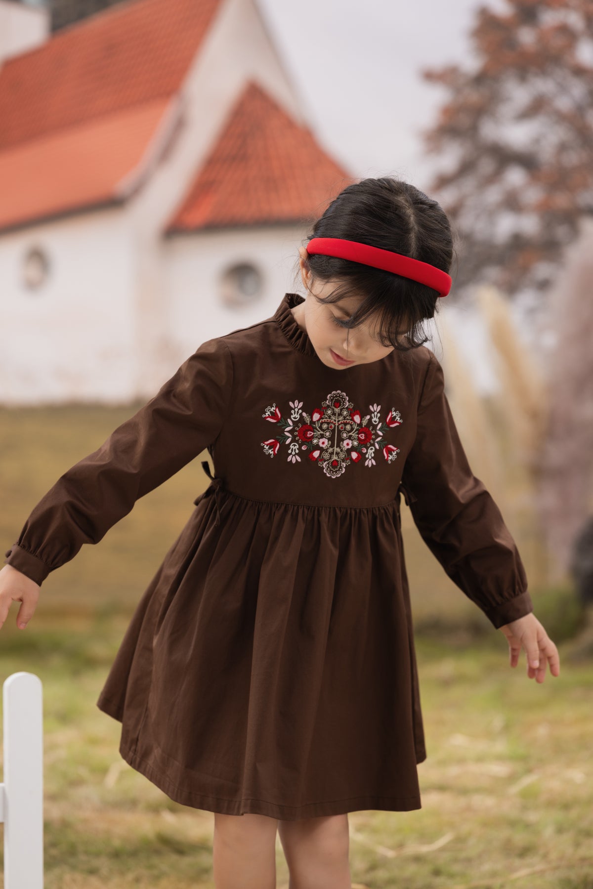 Vauva FW23 - Girls Brown Embroidered Cotton Dress model front -02