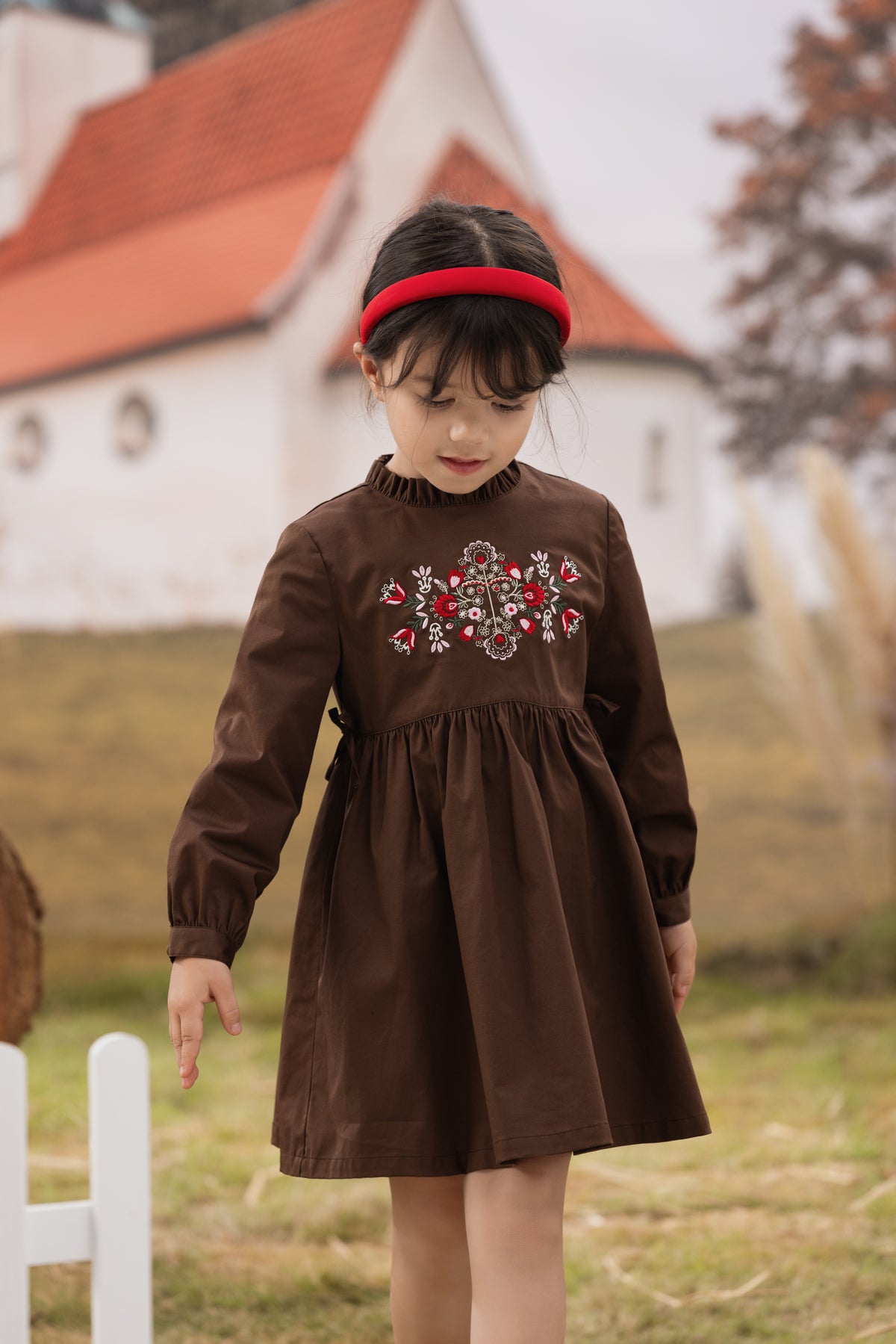 Vauva FW23 - Girls Brown Embroidered Cotton Dress model front