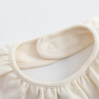 Vauva FW23 - Baby Girls Pinwheel All Over Print Ruffle Cotton Bib (White)