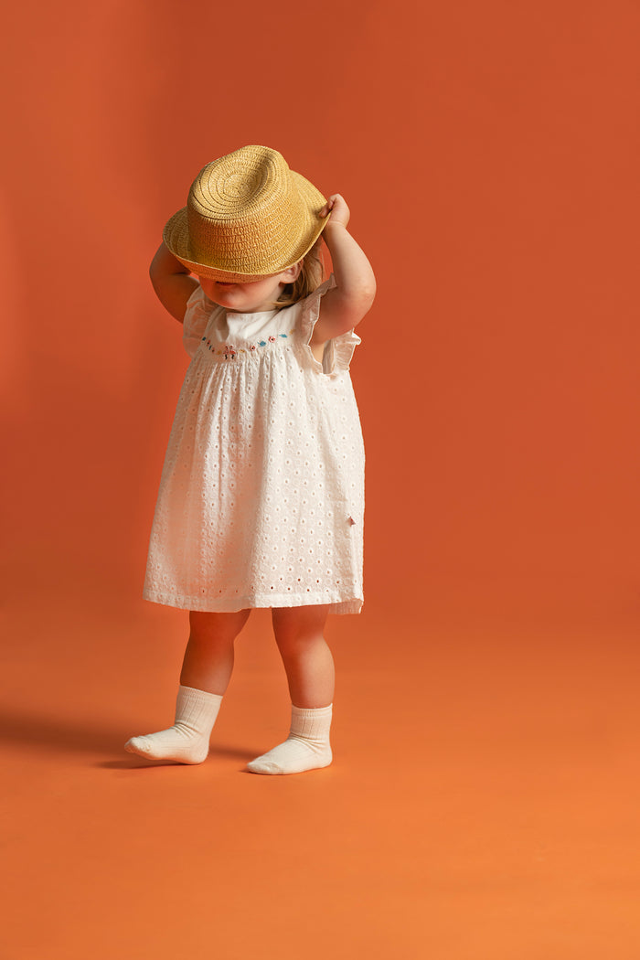 Vauva SS23 Safari - Baby Girls Eyelet Sleeves Cotton Dress-model image side